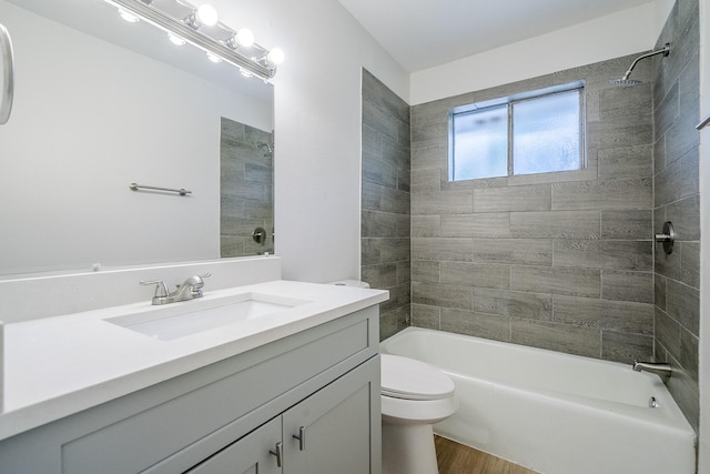 11063 Vailview Dr, Houston, TX 77016 - full bath with vanity, washtub / shower combination, toilet, and wood finished floors
