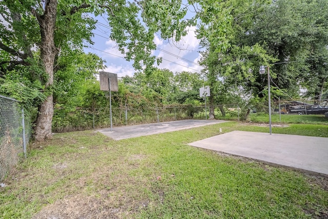 11063 Vailview Dr, Houston, TX 77016 - view of yard with community basketball court