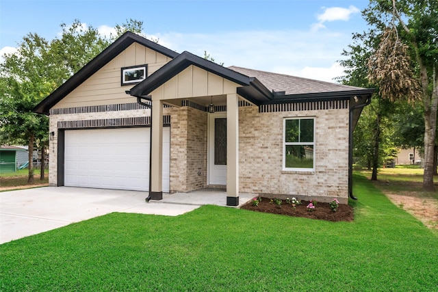 708 Azalea St, Prairie View, TX 77484 - view of front of house with concrete driveway, a front yard, an attached garage, and brick siding