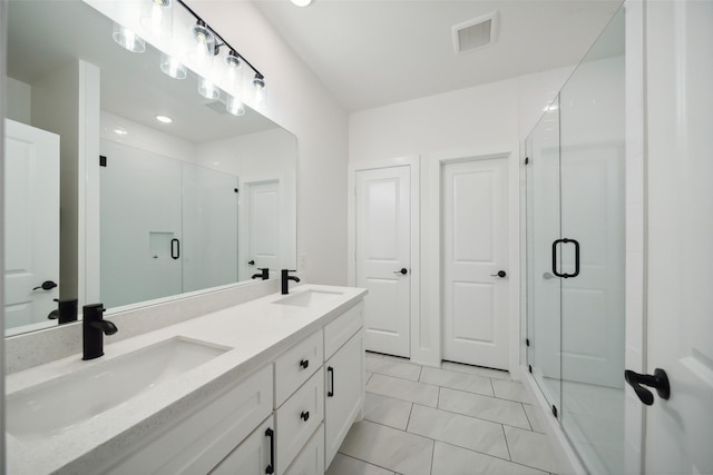 708 Azalea St, Prairie View, TX 77484 - bathroom featuring a stall shower and double vanity