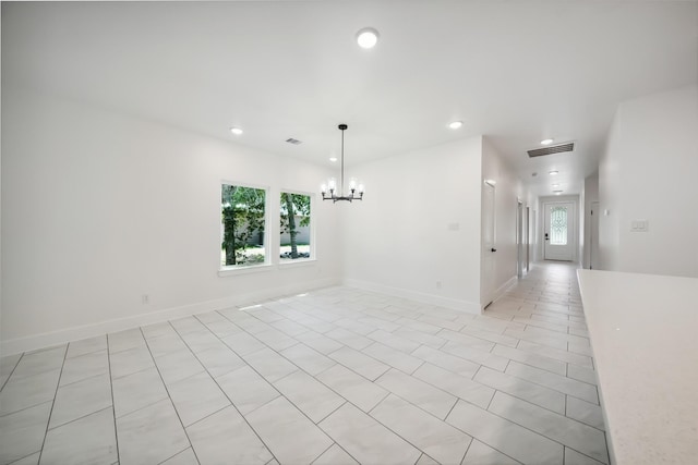 708 Azalea St, Prairie View, TX 77484 - empty room with plenty of natural light, recessed lighting, a chandelier, baseboards, and light tile patterned flooring