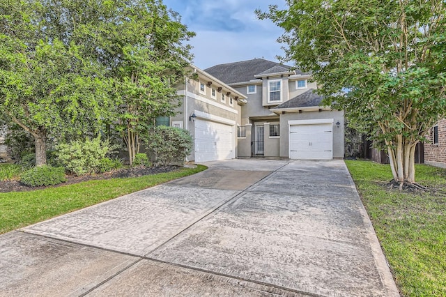 7203 Prairie Grass Ln, Katy, TX 77493 - view of front of property featuring driveway, stucco siding, a shingled roof, and a garage