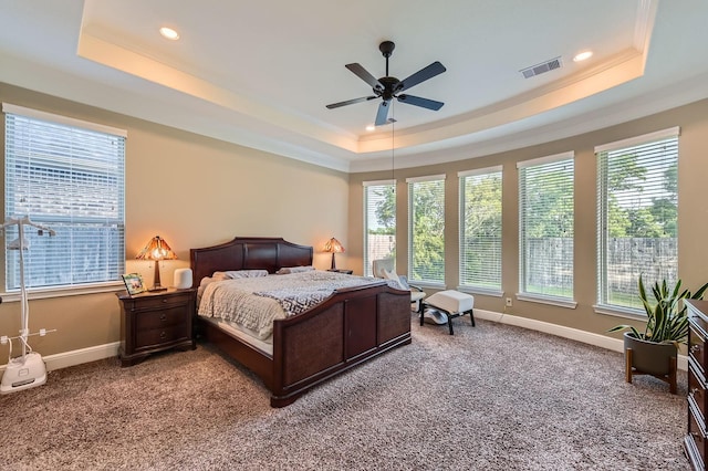 7203 Prairie Grass Ln, Katy, TX 77493 - bedroom featuring a raised ceiling, light colored carpet, multiple windows, ornamental molding, and recessed lighting