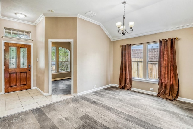 7523 Chathan Glen Ln, Richmond, TX 77407 - foyer featuring wood finished floors, a chandelier, crown molding, lofted ceiling, and baseboards