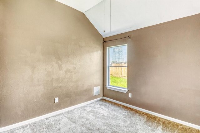 7523 Chathan Glen Ln, Richmond, TX 77407 - carpeted empty room featuring vaulted ceiling and baseboards