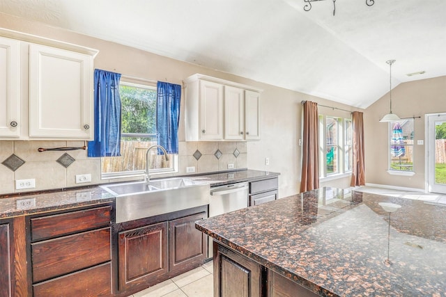 7523 Chathan Glen Ln, Richmond, TX 77407 - kitchen with a sink, stainless steel dishwasher, white cabinetry, vaulted ceiling, and light tile patterned floors
