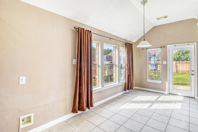 7523 Chathan Glen Ln, Richmond, TX 77407 - unfurnished dining area featuring plenty of natural light, vaulted ceiling, light tile patterned floors, and baseboards