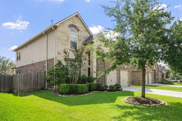 1406 Kallie Hills Ln, Spring, TX 77386 - view of front facade featuring stone siding, concrete driveway, and brick siding