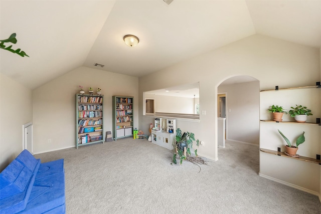 1406 Kallie Hills Ln, Spring, TX 77386 - game room featuring lofted ceiling, carpet flooring, arched walkways, and baseboards