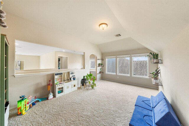 1406 Kallie Hills Ln, Spring, TX 77386 - recreation room with carpet floors, lofted ceiling, and arched walkways