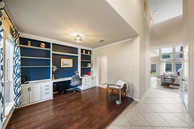 1406 Kallie Hills Ln, Spring, TX 77386 - home office with built in study area, crown molding, built in features, light wood finished floors, and baseboards