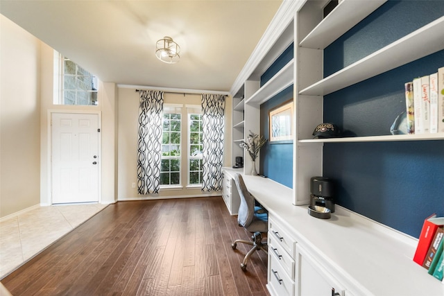 1406 Kallie Hills Ln, Spring, TX 77386 - office featuring built in study area, dark wood finished floors, and baseboards