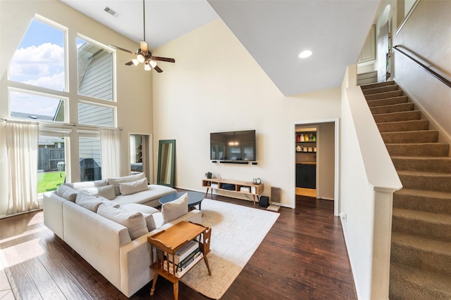 1406 Kallie Hills Ln, Spring, TX 77386 - living room featuring a high ceiling, dark wood-style floors, stairway, a ceiling fan, and recessed lighting