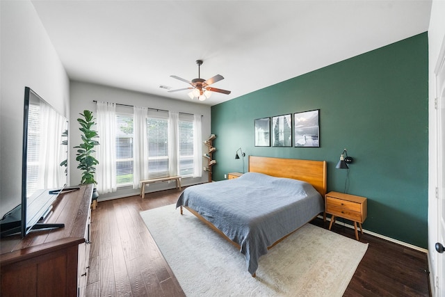 1406 Kallie Hills Ln, Spring, TX 77386 - bedroom with wood finished floors, a ceiling fan, and baseboards