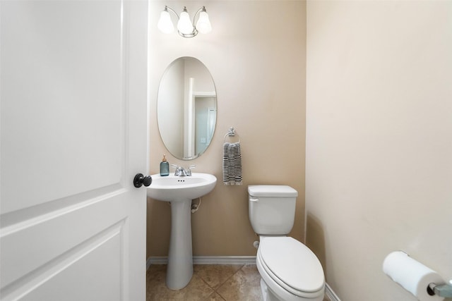 1406 Kallie Hills Ln, Spring, TX 77386 - bathroom featuring toilet, tile patterned flooring, a sink, and baseboards