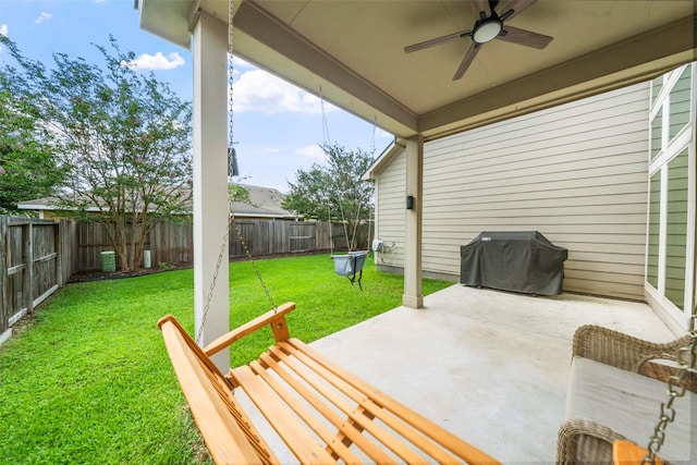 1406 Kallie Hills Ln, Spring, TX 77386 - view of patio with a ceiling fan and a grill