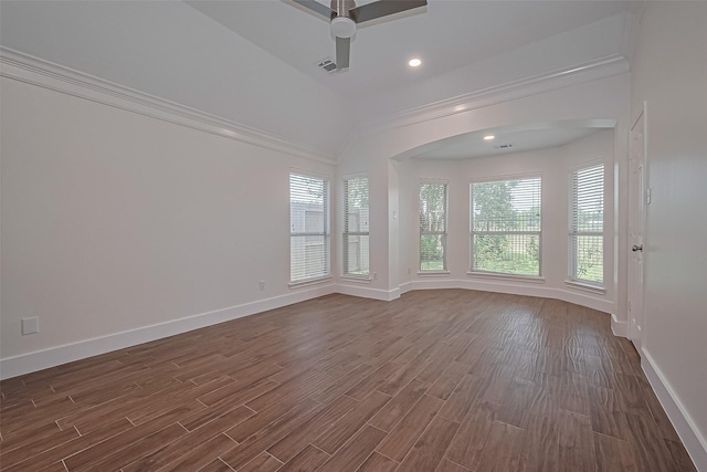 4046 Dell Ln, Missouri City, TX 77459 - spare room featuring a ceiling fan, dark wood-style floors, arched walkways, crown molding, and recessed lighting