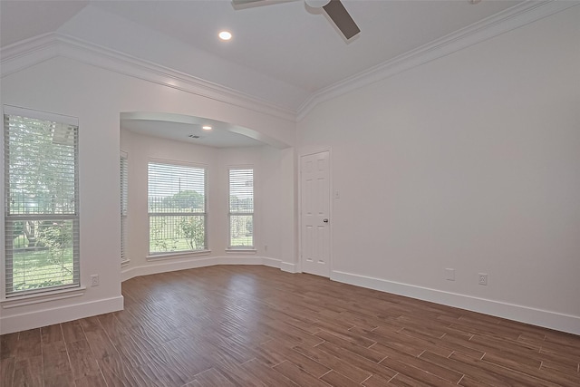 4046 Dell Ln, Missouri City, TX 77459 - unfurnished room with arched walkways, a ceiling fan, ornamental molding, healthy amount of natural light, and dark wood-style flooring