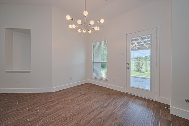 4046 Dell Ln, Missouri City, TX 77459 - unfurnished dining area with a chandelier and dark wood-style flooring