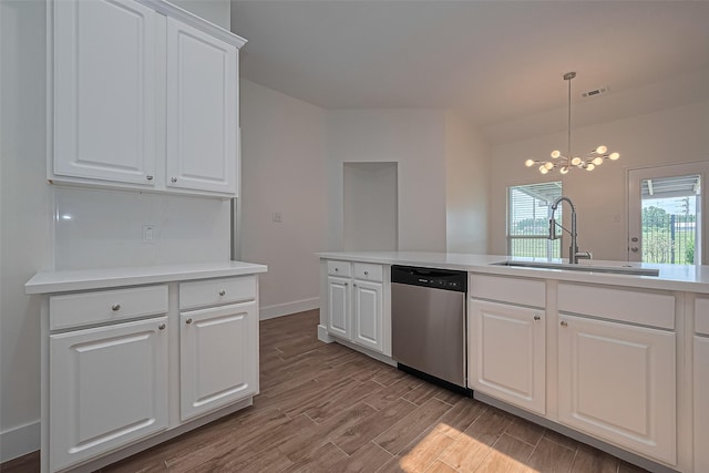 4046 Dell Ln, Missouri City, TX 77459 - kitchen with stainless steel dishwasher, a chandelier, wood finished floors, light countertops, and white cabinetry
