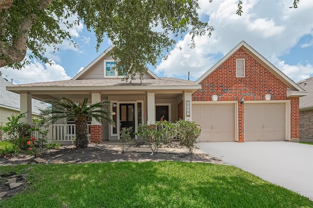 4046 Dell Ln, Missouri City, TX 77459 - view of front of house featuring brick siding, driveway, a front yard, covered porch, and a garage