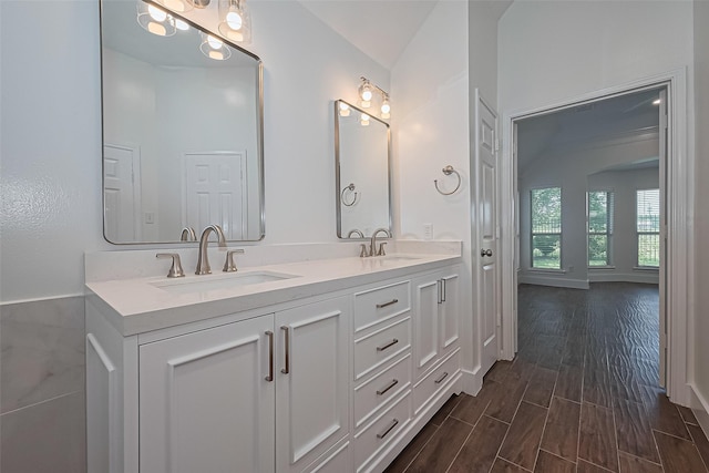 4046 Dell Ln, Missouri City, TX 77459 - full bathroom with double vanity and wood finished floors