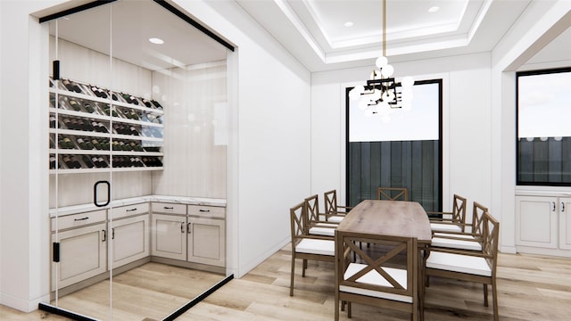 207 W 33rd St, Houston, TX 77018 - dining room featuring light wood-style floors, a chandelier, a tray ceiling, and recessed lighting