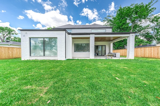 207 W 33rd St, Houston, TX 77018 - back of house featuring a patio and brick siding