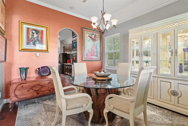 18 Brookefield Cir, Magnolia, TX 77355 - dining space with arched walkways, a chandelier, ornamental molding, and baseboards