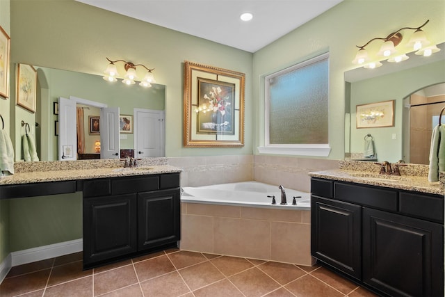 18 Brookefield Cir, Magnolia, TX 77355 - full bath with two vanities, a bath, and tile patterned floors