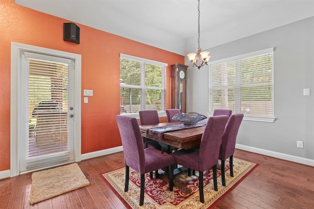 18 Brookefield Cir, Magnolia, TX 77355 - dining area with a chandelier, hardwood / wood-style floors, and baseboards