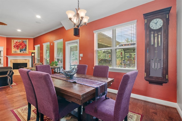18 Brookefield Cir, Magnolia, TX 77355 - dining area featuring baseboards, a chandelier, ornamental molding, wood finished floors, and recessed lighting