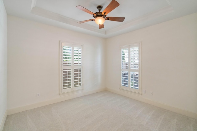 5507 Val Verde St, Houston, TX 77056 - unfurnished room with a tray ceiling, light colored carpet, and a ceiling fan