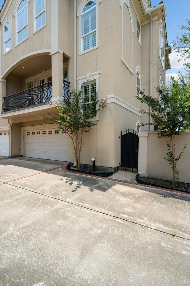 5507 Val Verde St, Houston, TX 77056 - view of property featuring an attached garage and concrete driveway