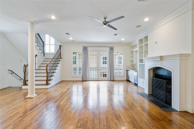 5507 Val Verde St, Houston, TX 77056 - unfurnished living room with ceiling fan, a fireplace with flush hearth, light wood finished floors, stairway, and built in features