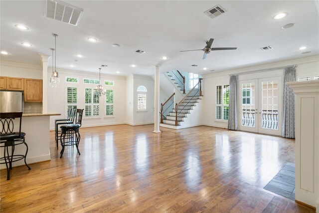 5507 Val Verde St, Houston, TX 77056 - living area featuring crown molding, ceiling fan, recessed lighting, light wood finished floors, and stairway