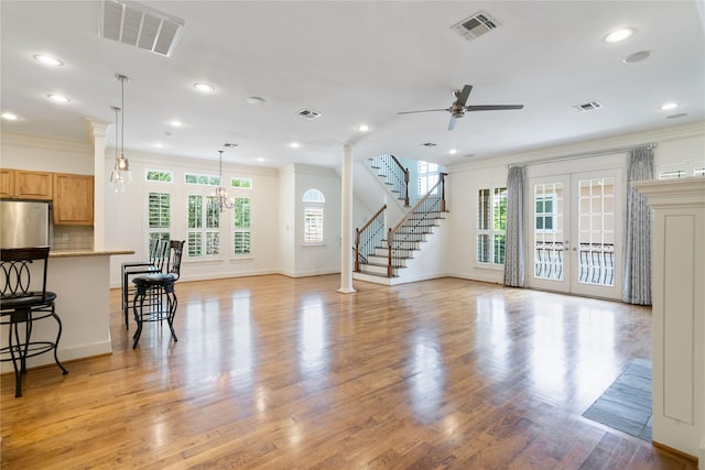 5507 Val Verde St, Houston, TX 77056 - living area featuring crown molding, ceiling fan, recessed lighting, light wood-style floors, and stairway