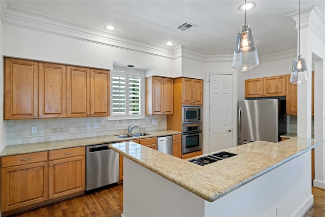 5507 Val Verde St, Houston, TX 77056 - kitchen with stainless steel appliances, crown molding, brown cabinetry, tasteful backsplash, and light stone counters
