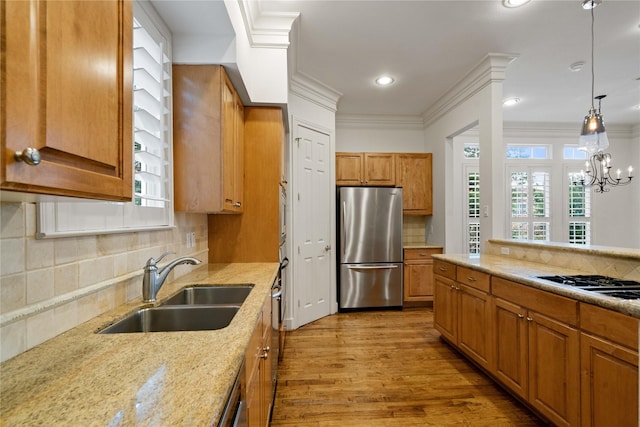 5507 Val Verde St, Houston, TX 77056 - kitchen featuring stainless steel appliances, light wood-type flooring, light stone counters, decorative backsplash, and ornamental molding
