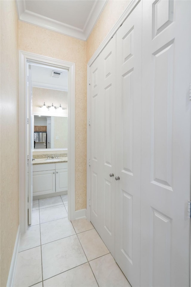 5507 Val Verde St, Houston, TX 77056 - hall featuring ornamental molding and light tile patterned floors
