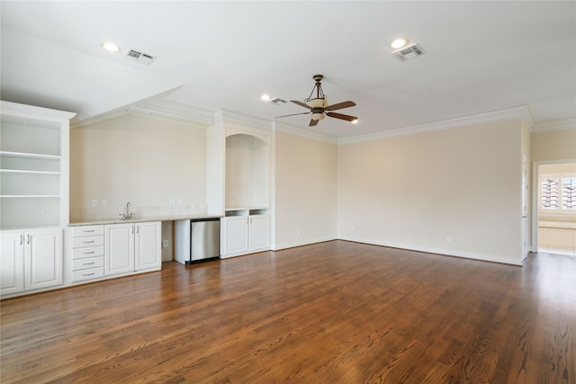 5507 Val Verde St, Houston, TX 77056 - unfurnished room with a ceiling fan, crown molding, dark wood finished floors, and recessed lighting
