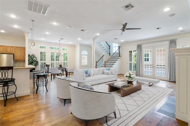 5507 Val Verde St, Houston, TX 77056 - living room featuring ornamental molding, a ceiling fan, recessed lighting, light wood finished floors, and stairs