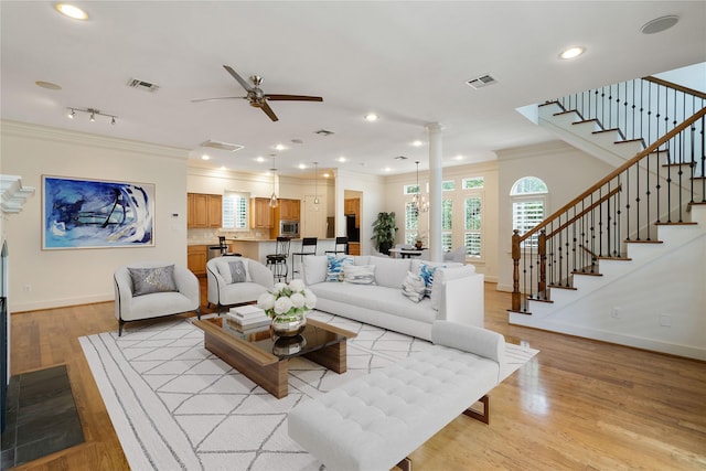 5507 Val Verde St, Houston, TX 77056 - living area with ornamental molding, stairway, ceiling fan, light wood finished floors, and recessed lighting