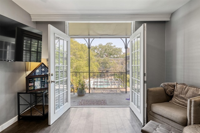 3300 Yorktown St Unit 24, Houston, TX 77056 - doorway featuring french doors, wood finished floors, ornamental molding, and baseboards