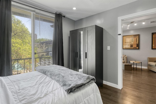 3300 Yorktown St Unit 24, Houston, TX 77056 - bedroom featuring baseboards, dark wood finished floors, and recessed lighting