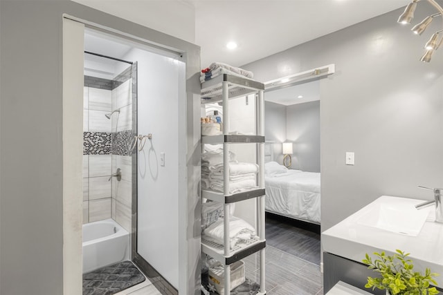 3300 Yorktown St Unit 24, Houston, TX 77056 - ensuite bathroom with vanity, washtub / shower combination, and recessed lighting