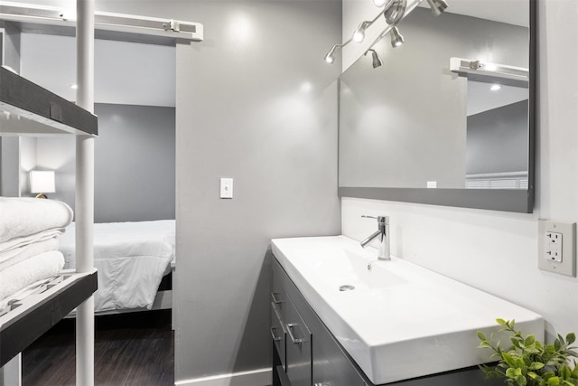 3300 Yorktown St Unit 24, Houston, TX 77056 - bathroom featuring vanity, connected bathroom, and wood finished floors