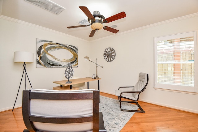 902 Cohn St, Houston, TX 77007 - living area with light wood finished floors, baseboards, crown molding, and ceiling fan