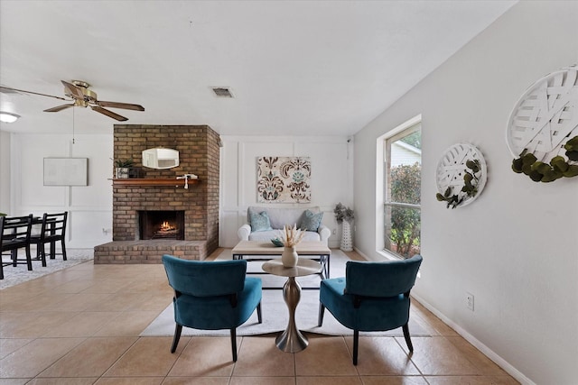 11731 Bexar Dr, La Porte, TX 77571 - tiled living room featuring ceiling fan and a fireplace