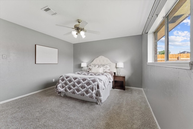 11731 Bexar Dr, La Porte, TX 77571 - bedroom featuring carpet flooring, baseboards, and a ceiling fan